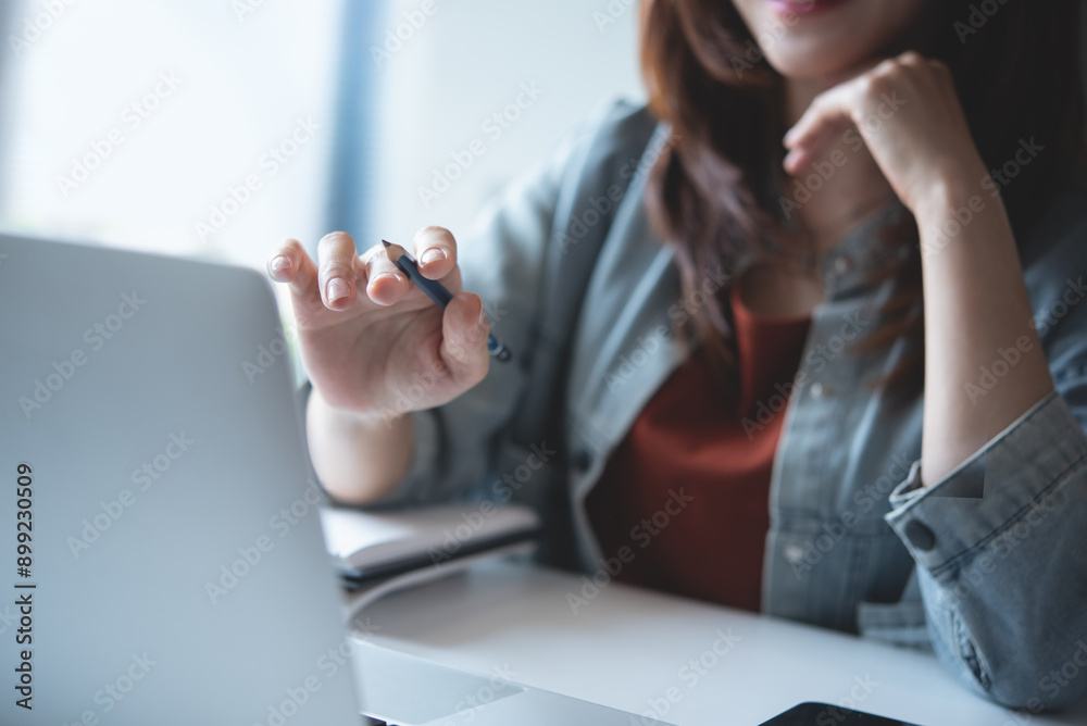 Canvas Prints close-up, young asian business woman working on laptop computer. video call using laptop for online 