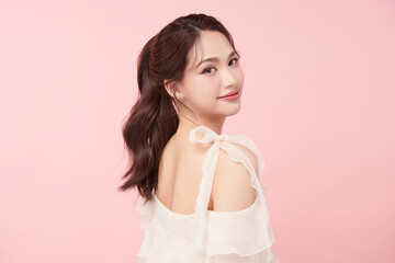 Beautiful young asian woman with clean fresh skin on pink background, Face care, Facial treatment, Cosmetology, beauty and spa, Asian women portrait.