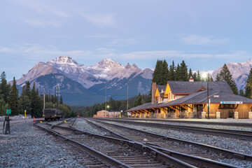 Banff Railway Station in summer evening. Banff National Park, Canadian Rockies. Banff, Alberta,...