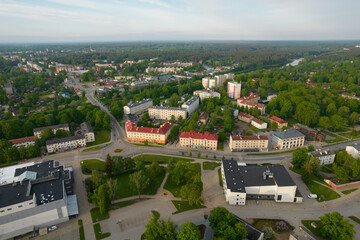 Obraz premium Aerial View Of Scenic Town Surrounded By Lush Greenery And Forest. City Valmiera, Latvia