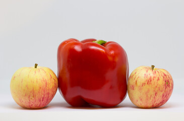 apples and paprika in close-up