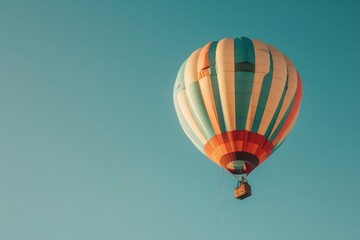 Obraz premium colorful hot air balloon flying on blue sky. adventure