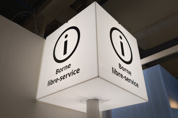 self-service terminal checkout kiosk information text sign place of self service payment machine in shop