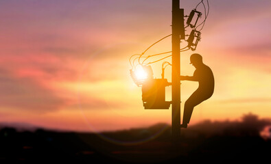 Electric engineer climb high pole sunset background
