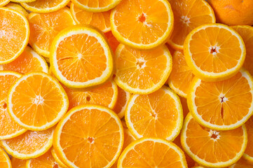 Yellow juicy orange on a background. Background on the theme of fruits, citrus fruits.