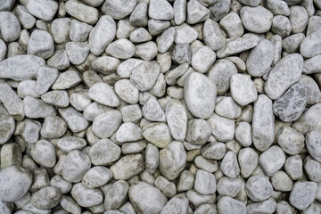 Top view of grey and white river stones