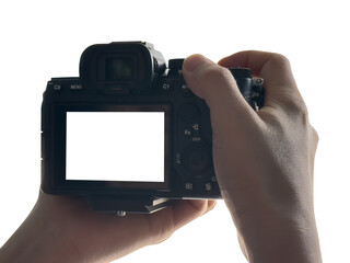Hand holding Mirrorless camera with white screen isolated on transparent background. PNG File