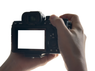 Hand holding Mirrorless camera with white screen isolated on transparent background. PNG File