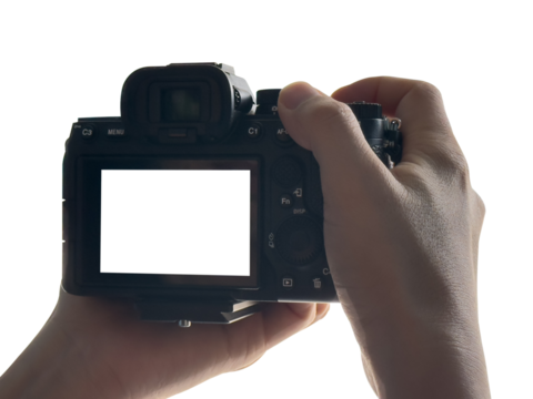 Hand holding Mirrorless camera with white screen isolated on transparent background. PNG File