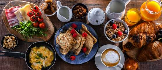 Breakfast served with coffee, eggs, cereals nd croissants