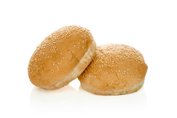 Sesame bun for burger isolated on white background with clipping path.