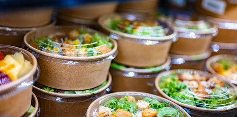 Vegetable salads displayed in a commercial refriger