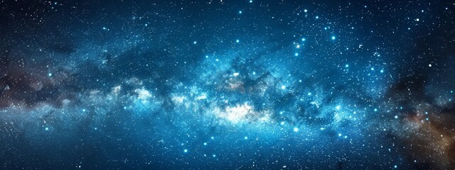 Fototapeta premium A dark blue sky filled with numerous bright blue and white stars, scattered like constellations against a backdrop of twinkling stars