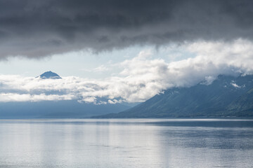 Turnagain Arm, It is one of two narrow branches at the north end of Cook Inlet, the other being Knik Arm. Turnagain is subject to climate extremes and large tide ranges. Kenai Mountains.
