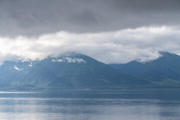 Turnagain Arm, It is one of two narrow branches at the north end of Cook Inlet, the other being Knik Arm. Turnagain is subject to climate extremes and large tide ranges. Kenai Mountains.
