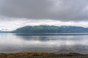 Turnagain Arm, It is one of two narrow branches at the north end of Cook Inlet, the other being Knik Arm. Turnagain is subject to climate extremes and large tide ranges. Kenai Mountains.
