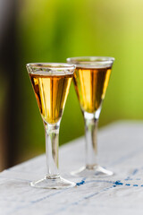 Two glasses of cognac in backlight - selective focus
