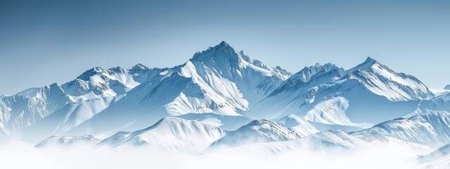 Fototapeta premium A towering mountain, completely snow-capped, dominates a clear blue sky with scattered clouds in the foreground