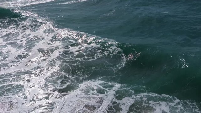 Crawling Sea Waves Over Foamy White Surface