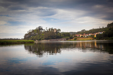Obraz premium Beautiful panoramic landscape of the El Castillo village and pier from the estuary in Soto del Barco. Asturias. Spain