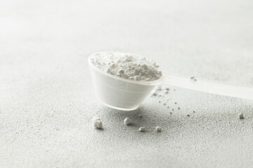 Powdered magnesium oxide or sulfate in a medicine spoon, water soluble drug group