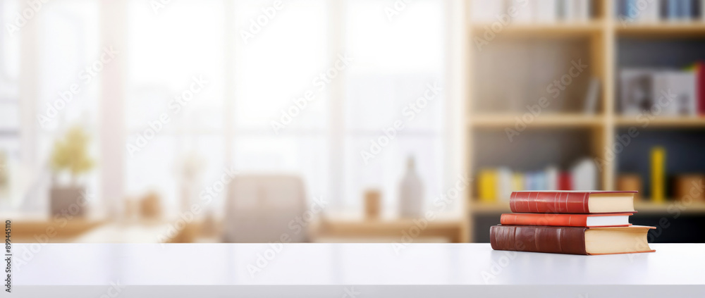 Poster stack of books on a white desk in a home office, perfect for displaying your products