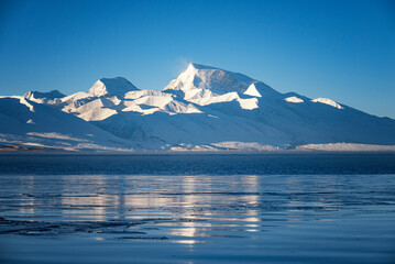 the sunrise of Lake Manasarovar and Naimona'nyi Peak/Gurla Mandhata