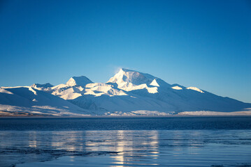the sunrise of Lake Manasarovar and Naimona'nyi Peak/Gurla Mandhata