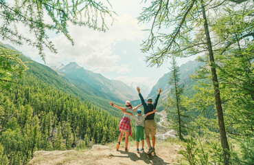 Happy family traveling in the mountains 