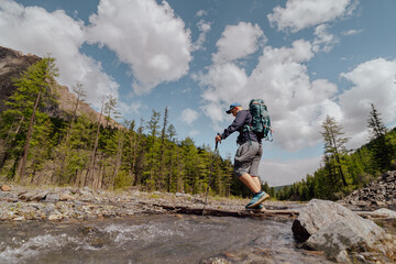 people backpacking trip in the mountains in summer 