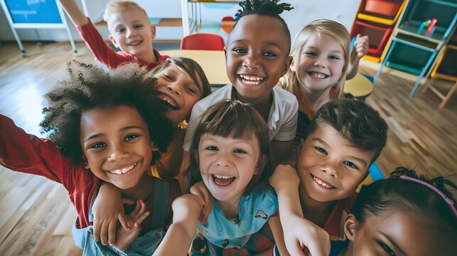 Group of diverse children smiling for a selfie.
