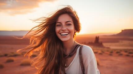 Fototapeta premium photograph of a radiant young woman with sun-kissed skin and flowing hair, her eyes sparkling with joy as she gazes out at the vast expanse of golden sand 