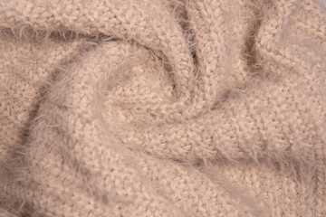 Knitwear texture. Soft texture of homemade cashmere wool sweater.