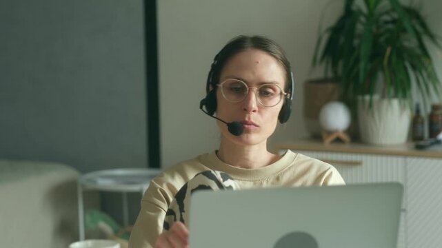 Woman sends emails to participants of video conference summarizing key points. Freelancer conducts video conference to answer questions of participants