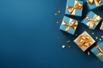 blue gifts with golden bows and ribbons placed on blue background, place for text