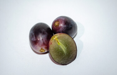 Bunch of ripe dark blue grapes Isolated on white background top view