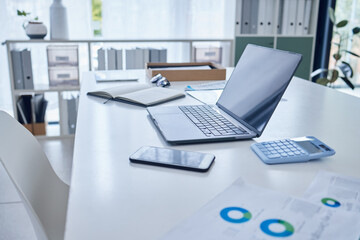 Office, table and paperwork with technology in boardroom for financial report, review and calculation. Notebook, documents and business meeting for project, task and presentation for company