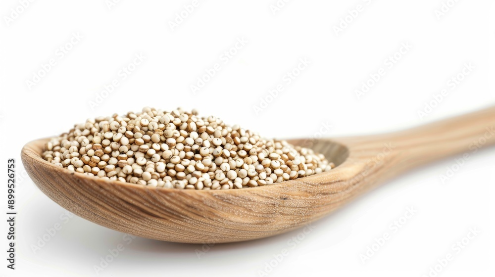 Sticker quinoa seeds on wooden spoon against white background