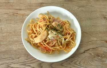 fried spaghetti Napolitan slice pork sausage with tomato topping parmesa cheese japanese food on plate