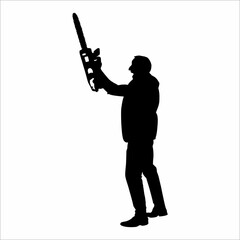 Silhouette of a man with a tree cutting tool