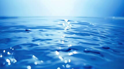 Obraz premium A serene blue background with gentle ripples resembling a calm ocean surface 