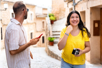 Sightseeing couple smiling and enjoying vacation