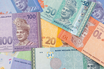 Colorful Mixed Malaysian Ringgit Banknotes Background - Financial Diversity.