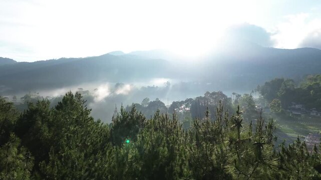 Panoramic view misty morning sunrise in mountain  at Bandung. West Java, Indonesia