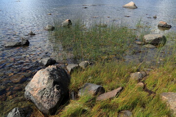 Rock and stones at the Baltic sea. Peaceful summer day. Fogdö, Roslagen, Stockholm, Sweden.