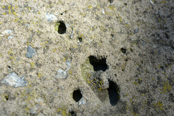 Building materials, dark gray stones poured with concrete mortar, construction, unusual backgrounds made of concrete.  