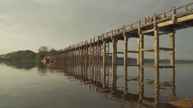 U Bein Bridge with lake, Wooden Bridge in Mon village, Myanmar or Burma, Asia.