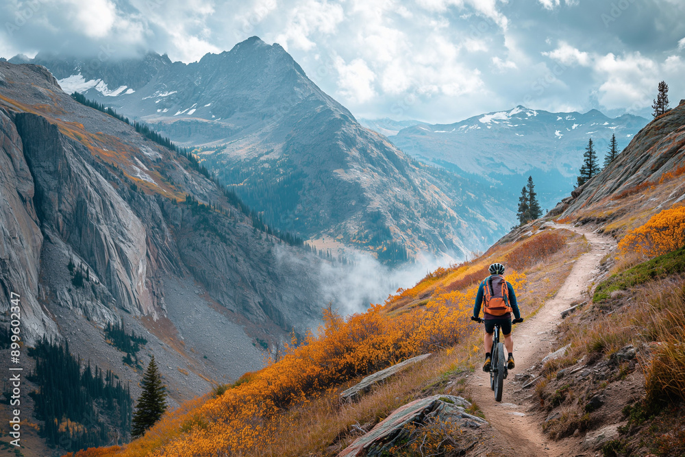 Sticker Mountain biker navigating a rugged trail with rocky terrain