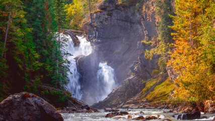 waterfall in autumn forest