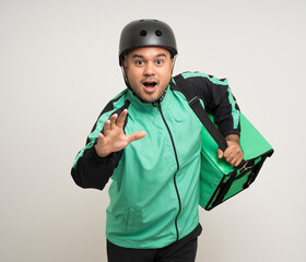 Young asian rider wearing green jacket uniform and bike helmet various action with delivery box. Male delivery service worker. Courier and shipping food service to customer online application